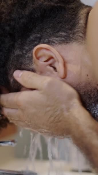 Bearded Man Washes His Face Shaving Fhd Vertical Video — Stock Video
