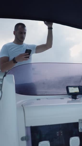 Boat Driven Bearded Man Next His Friend Standing Vertical Fhd — Stock Video