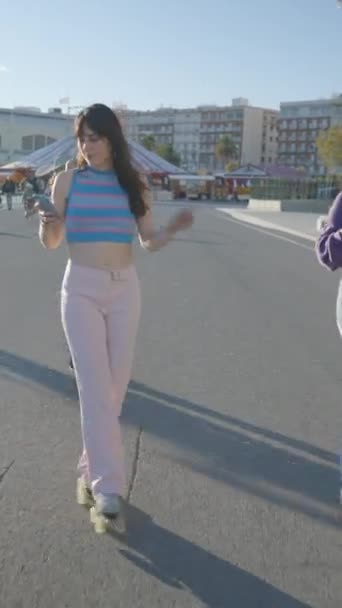 Frontal View Teenage Girls Using Phones While Roller Skating Sun — Stock Video