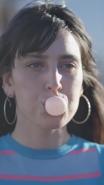 Close Frontal View Dark Haired Girl Blowing Bubble Chewing Gum — Stock Video