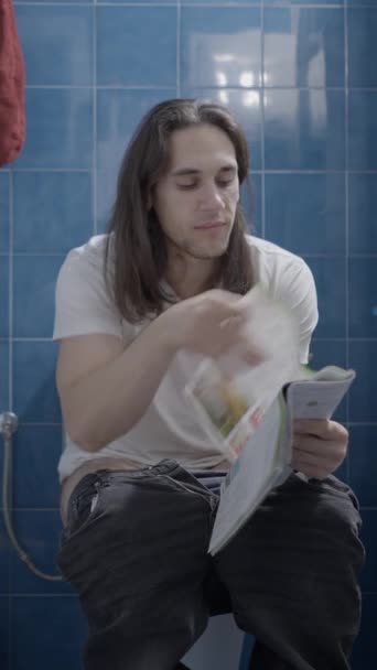 Young Caucasian Man Reading Newspapper Smiling While Shit Frontal Shot — Αρχείο Βίντεο