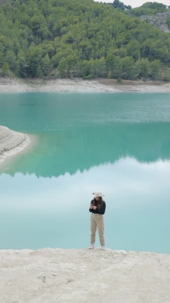 Wide View Girl Put Phone Pocket Walking Lake Spain Vertical — Stok Video