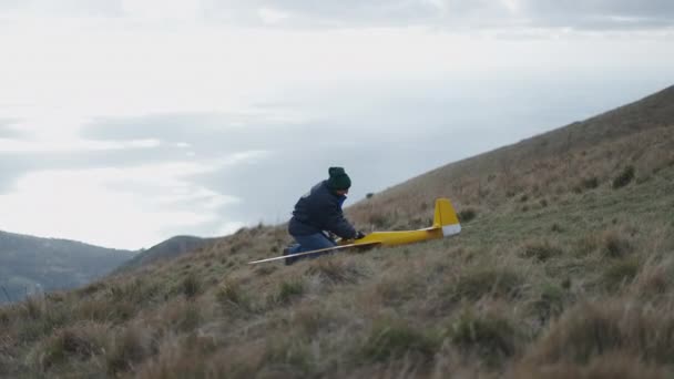 Man Makes Adjustments His Yellow Plane Horizontal Video — Stock Video