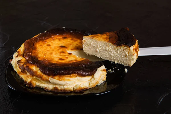 Basque Cheesecake Black Plate Black Slate One Piece Cut Raised — Stock Photo, Image