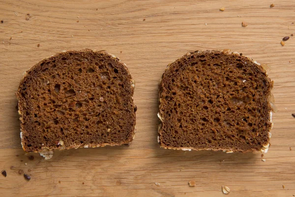 Two Slices Rye Brown Bread Flax Sunflower Seeds Lie Side — Stock Photo, Image