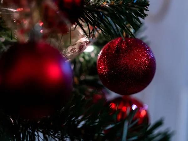 Christmas shiny red ball decoration on christmas tree