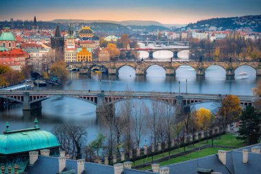 Above Prague old town bridges and river Vltava at dramatic dawn, Czech Republic