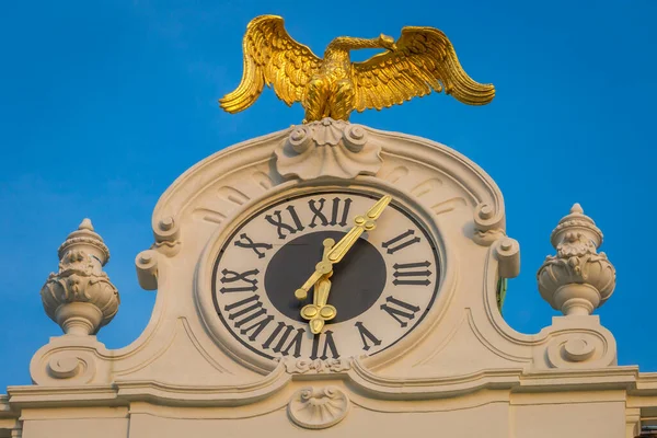 Clock tower with royal golden eagle over hofburg , Vienna at sunrise, Austria