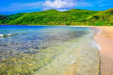 Tropical paradise, sandy beach at summer day in Fiji Islands, Pacific ocean