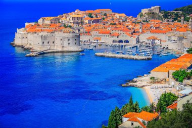 Dubrobvik medieval old town, turquoise adriatic beach in Dalmatia, Croatia clipart