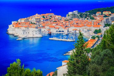 Dubrobvik medieval old town, turquoise adriatic beach in Dalmatia, Croatia