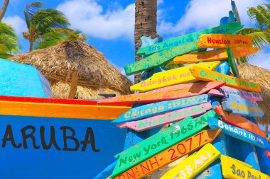 Aruba and colorful Crossroads set signs distances, various locations around the world