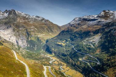 Grimsel and Furka mountain pass, dramatic road with swiss alps at sunny day, Switzerland clipart