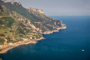 Above Amalfi Coast, coastline with boats and cliffs from Ravello village, Italy