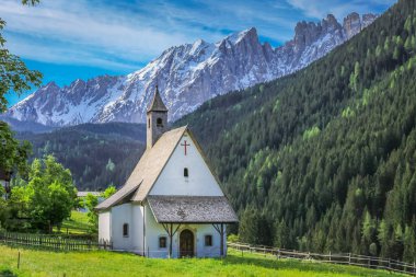 Dolomites italian alpine church, idyllic chapel near Cortina and Falzarego Pass, Italy