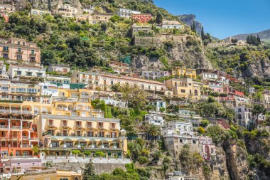 Idyllic Positano city cliffs and marina with boats and yacht, amalfi coast, Italy