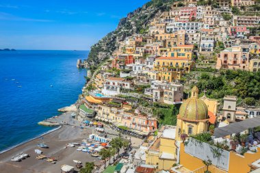 Idyllic Positano city cliffs and marina with boats and yacht, amalfi coast, Italy