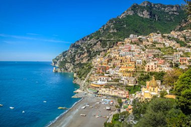 Idyllic Positano city cliffs and marina with boats and yacht, amalfi coast, Italy
