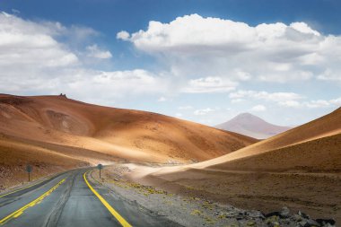 Road in Peaceful Moon Valley dramatic landscape at Sunset, Atacama Desert, Chile
