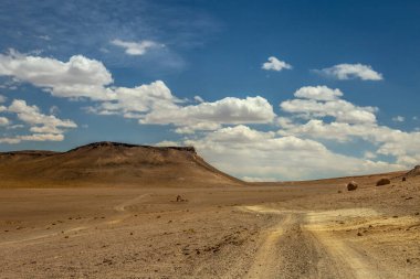 Dirt Road in Peaceful Moon Valley dramatic landscape at Sunset, Atacama Desert, Chile