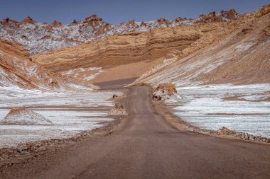 Dirt Road in Peaceful Moon Valley dramatic landscape at Sunset, Atacama Desert, Chile