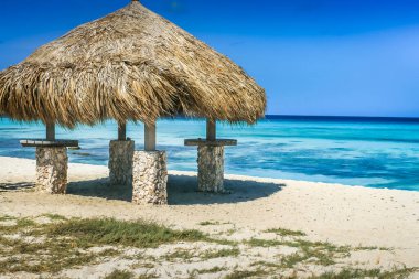 Secluded Beach with palapa on Aruba island in the Caribbean Sea, Dutch Antilles
