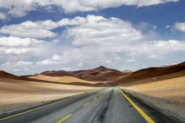 Road in Peaceful Moon Valley dramatic landscape at Sunset, Atacama Desert, Chile