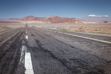 Road in Peaceful Moon Valley dramatic landscape at Sunset, Atacama Desert, Chile