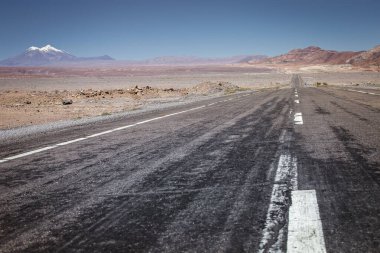 Road in Peaceful Moon Valley dramatic landscape at Sunset, Atacama Desert, Chile