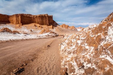 Dirt Road in Peaceful Moon Valley dramatic landscape at Sunset, Atacama Desert, Chile