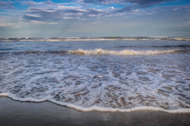 Secluded beach in Torres at dramatic evening, Rio Grande do Sul, Southern Brazil
