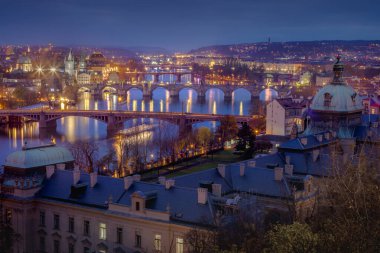 Panoramic view over the cityscape of Prague and Vltava river at dramatic evening, Czech Republic