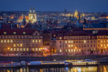Panoramic view over the cityscape of Prague and Vltava river at dramatic evening, Czech Republic