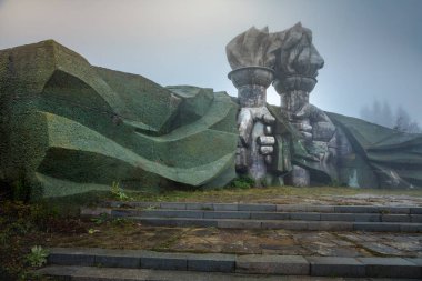 Soviet abandoned monument Buzludja Memorial In Bulgaria countryside at mist evening, Eastern europe