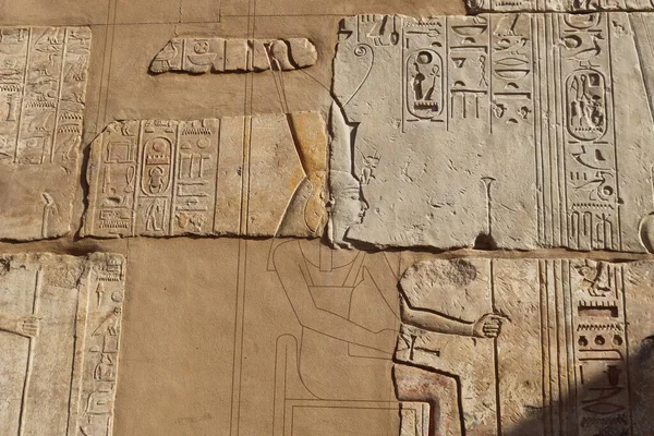 Ancient egyptian carvings and hieroglyphs at Satet temple in Aswan, Egypt