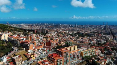 Aerial view of Barcelona city skyline, Sagrada Familia Basilica and Eixample residential district. Sunny day, Catalonia, Spain clipart