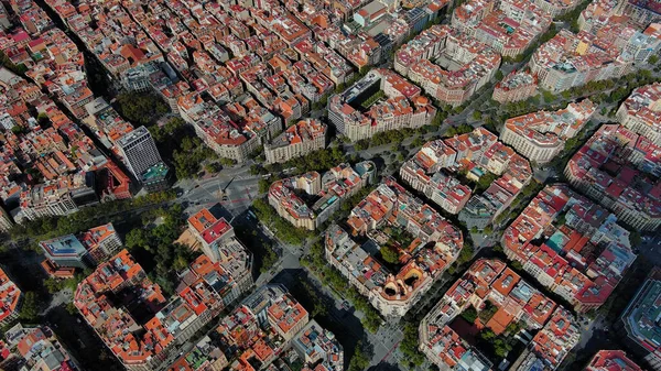 stock image Aerial Birds Eye view of square buildings and traffic moving through Barcelona streets in Catalonia, Spain. Eixample residential district