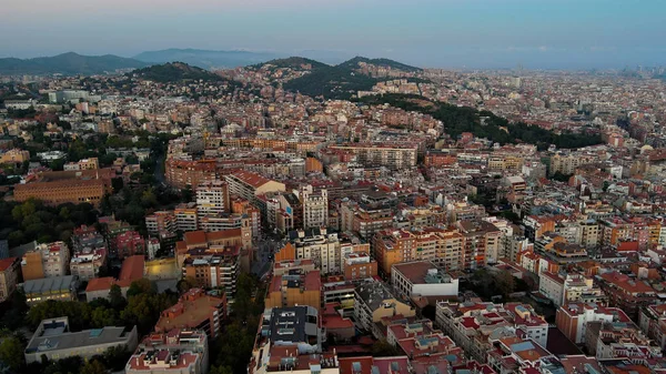 stock image Aerial view of Barcelona city skyline at dusk, Gracia and Horta Guinardo districts. Catalonia, Spain