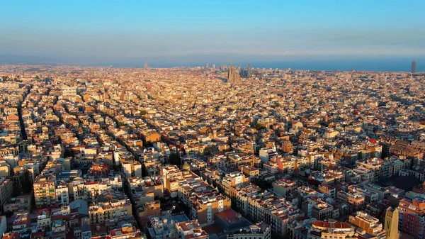 stock image Aerial view of Barcelona city skyline, Gracia and Eixample residential urban grid at sunset, Catalonia, Spain