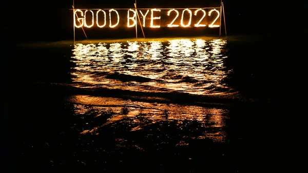 Good Bye 2022 Burning Phrase Made Fire Stick Placed Water Royalty Free Stock Photos