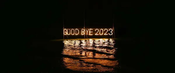 Good Bye 2023 Illuminated Sign Installation Water Beach Black Background Stock Image