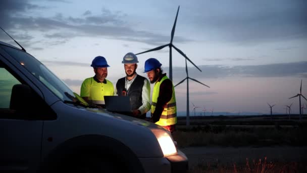 Team Work Three Renewable Energy Engineers Helmets Protection Equipment Working — Vídeo de stock