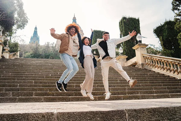 Group Multiracial Happy Friends Having Fun Jumping Street Spreading Arms — Stock Photo, Image