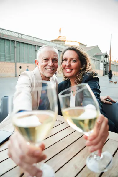 Vertical Mature Smiling Couple Toasting White Wine Glasses Camera Middle — Stock Photo, Image