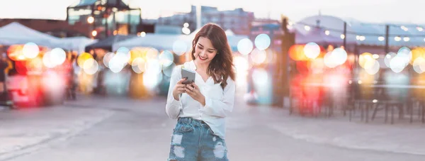 People using internet technology for communication lifestyles. Beauty young adult asian woman using smart phone and texting social message for dating online. Banner background.