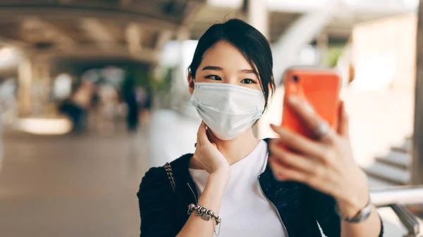 stock image Selfie young adult business asian working woman. close up face and mask for protect virus corona or covid19. Urban people lifestyle with public health and social distance on day concept.