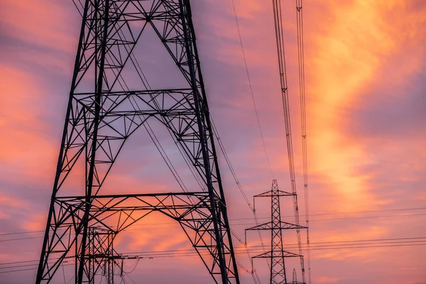 stock image Electricity pylons at orange sunset. High quality photo