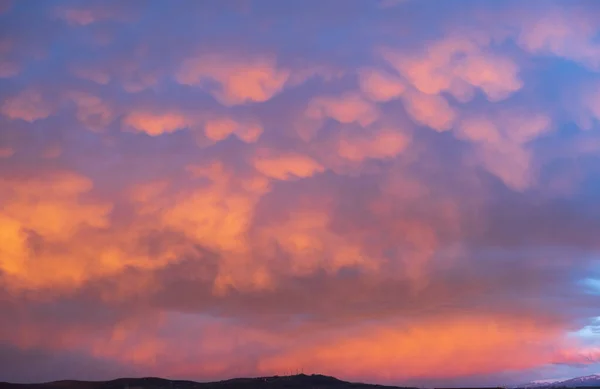 stock image Panorama of morning sunrise with a perfect colorful sky and heavenly clouds.