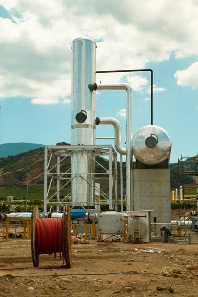geothermal energy hot water extraction pump, industrial plant, oil refinery, pipes and gas pipeline,