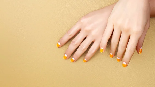 Beautiful Female Hands Bright Orange Manicure Candy Corn Yellow Background Stok Resim